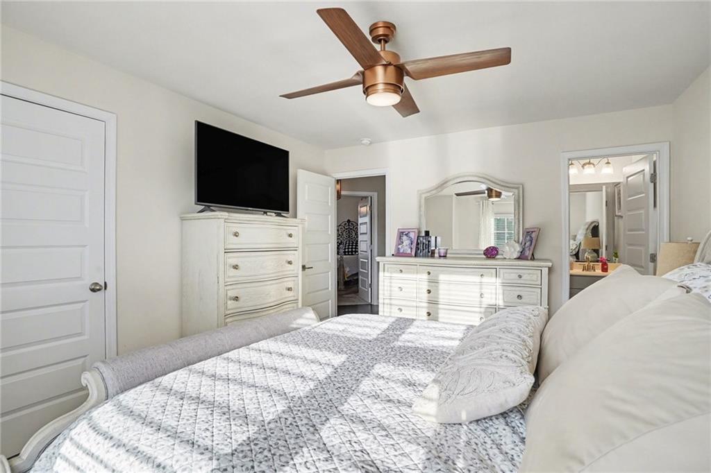 110 Canal Street Hampton, GA 30228 - Photo 35 of 41 a bed room with a bed a television and dresser