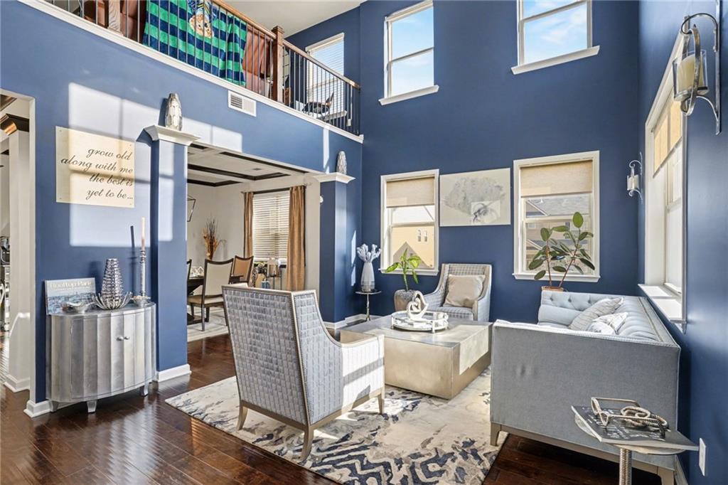 110 Canal Street Hampton, GA 30228 - Photo 4 of 41 a living room with fireplace furniture and a wooden floor