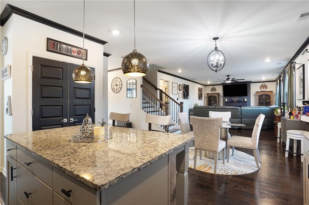 110 Canal Street Hampton, GA 30228 - Photo 10 of 41 a view of dining table and chairs