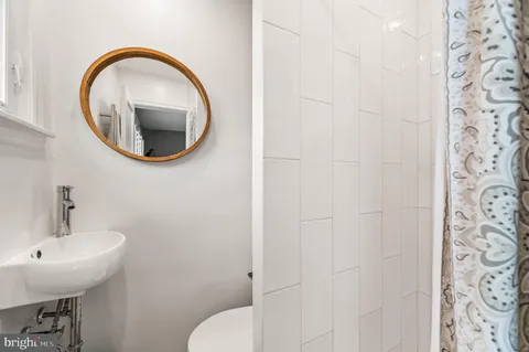 a bathroom with a toilet and a sink