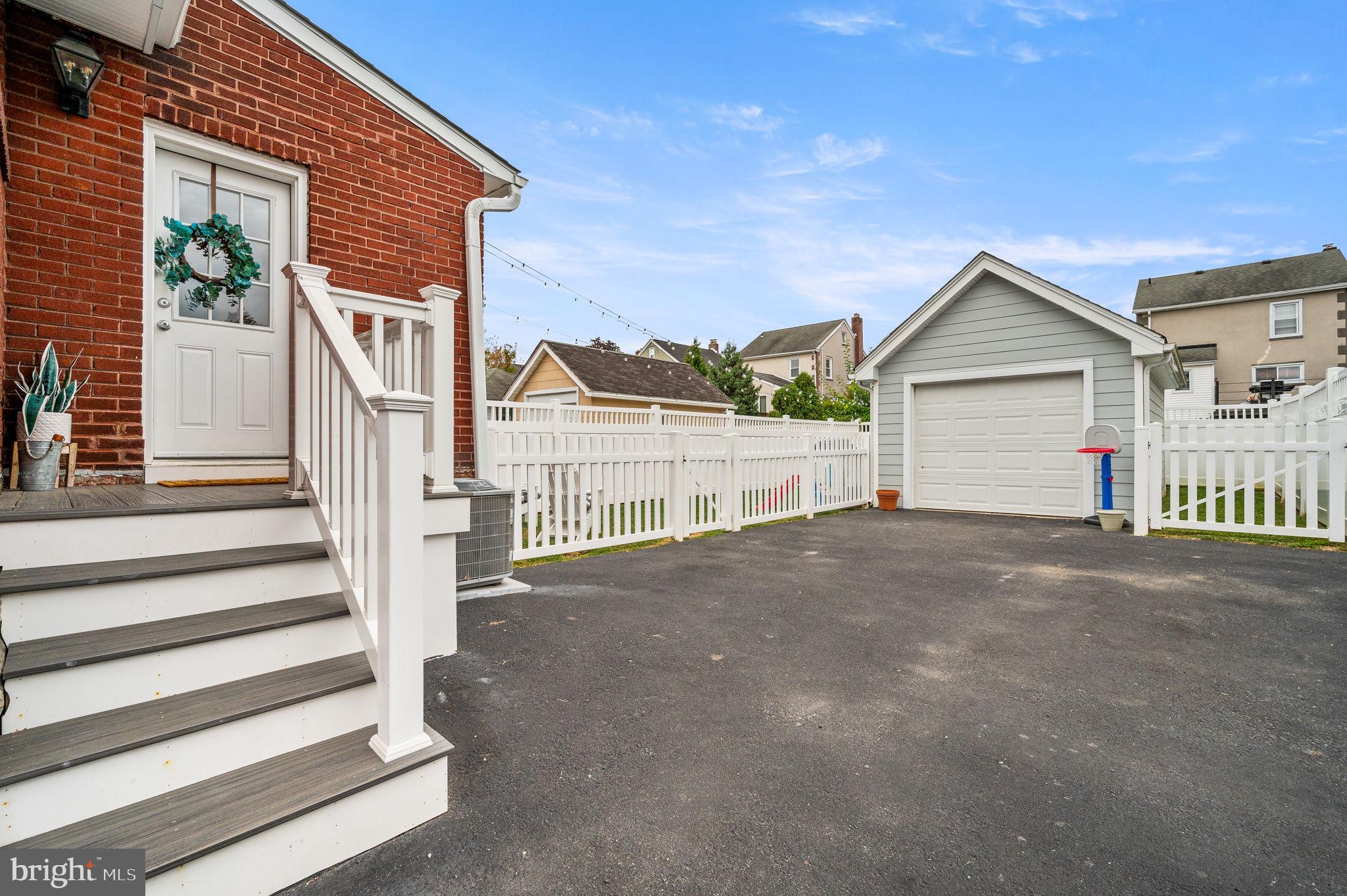 168 Upland Road Havertown, PA 19083 - Photo 25 of 32 a view of a house with a yard and garage