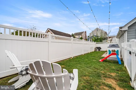 a view of a chairs and table in patio