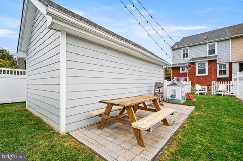 a view of a patio with chairs and table in a patio