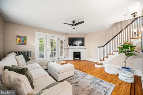 a living room with furniture fireplace and flat screen tv