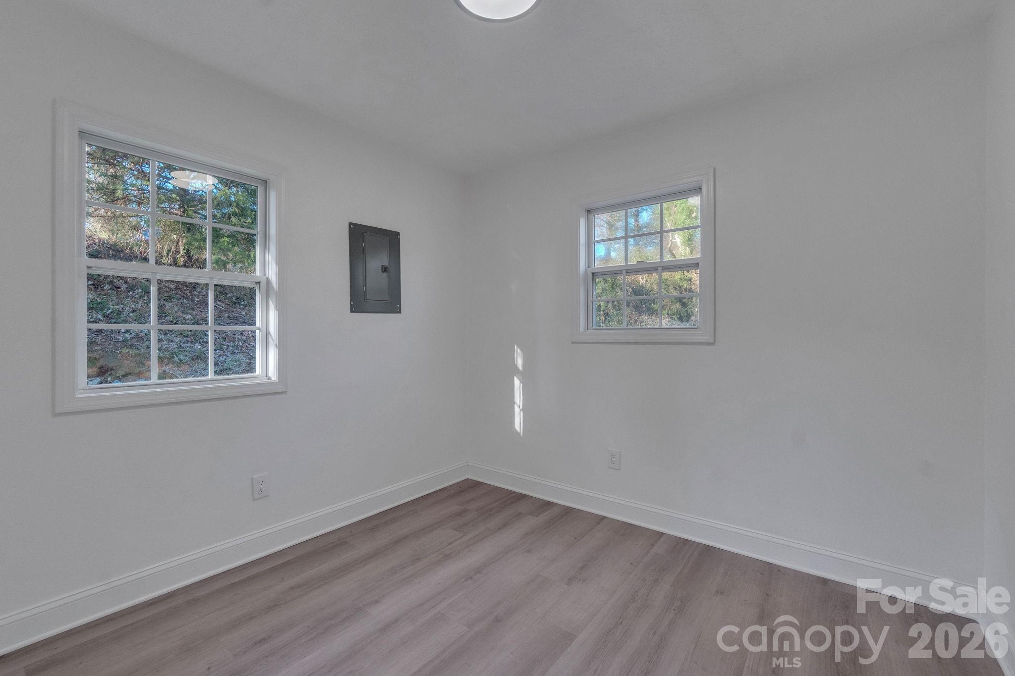49 East Livingston Street Tryon, NC 28782 - Photo 17 of 27 an empty room with a window