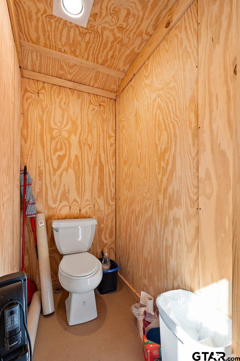 300 Industrial Drive Rusk, TX 75785 - Photo 11 of 11 a white toilet sitting next to a white curtain