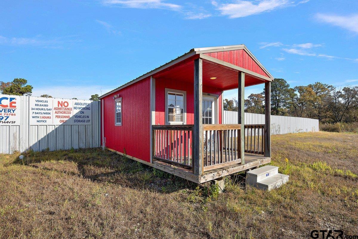 300 Industrial Drive Rusk, TX 75785 - Photo 9 of 11 a view of a backyard with a small cabin