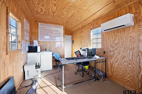 a white toilet sitting next to a white curtain