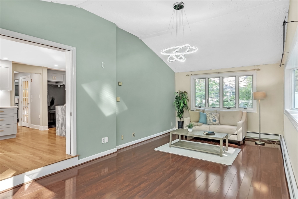 38 Maple Street Lexington, MA 02420 - Photo 12 of 40 a room with gym equipment and a large window