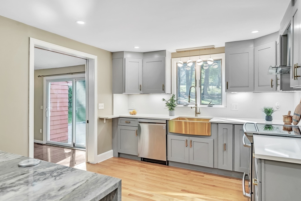 38 Maple Street Lexington, MA 02420 - Photo 19 of 40 a kitchen with a sink cabinets and window