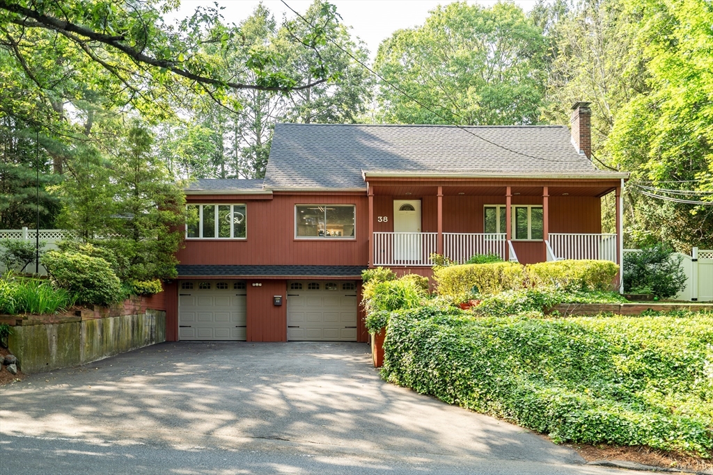 38 Maple Street Lexington, MA 02420 - Photo 2 of 40 a front view of a house with a garden