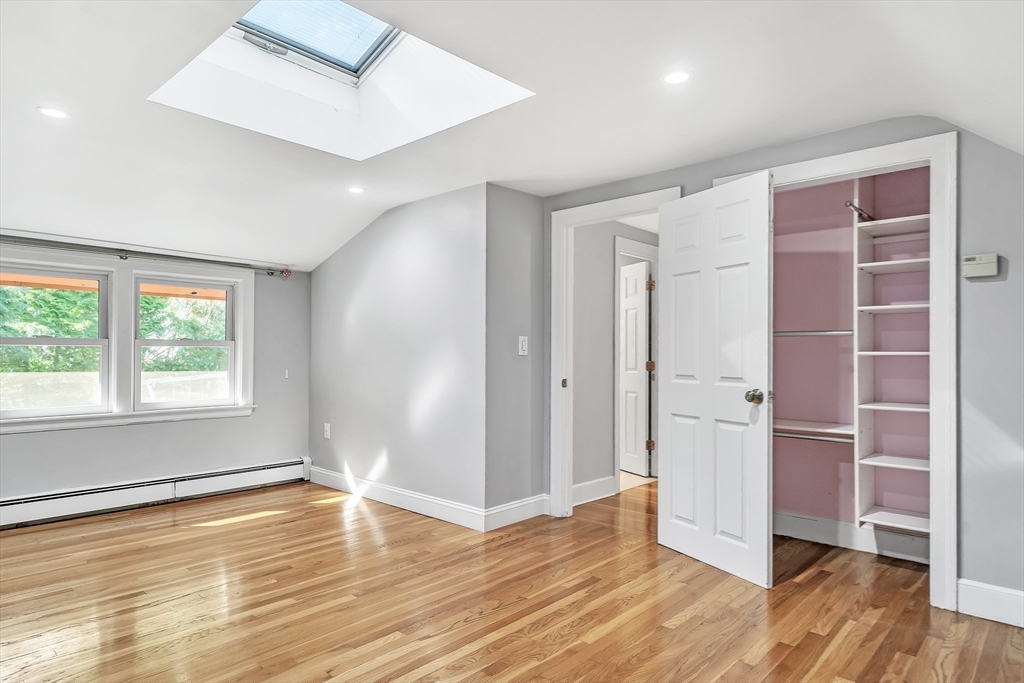 38 Maple Street Lexington, MA 02420 - Photo 26 of 40 wooden floor in an empty room with a window