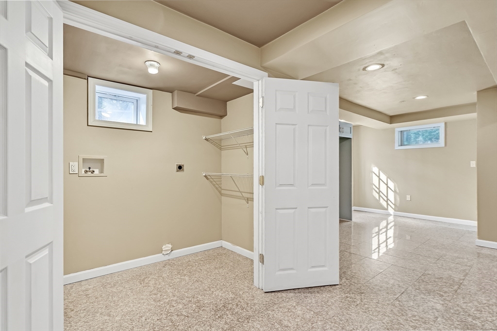 38 Maple Street Lexington, MA 02420 - Photo 30 of 40 an empty room with windows and refrigerator