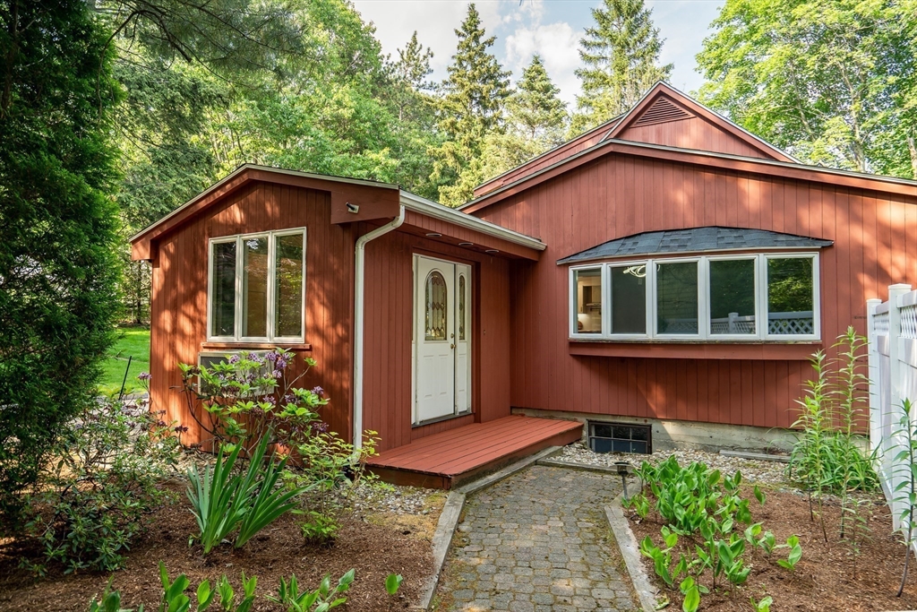 38 Maple Street Lexington, MA 02420 - Photo 33 of 40 a front view of a house with a yard