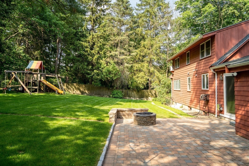 38 Maple Street Lexington, MA 02420 - Photo 34 of 40 a view of a house with backyard and a tree