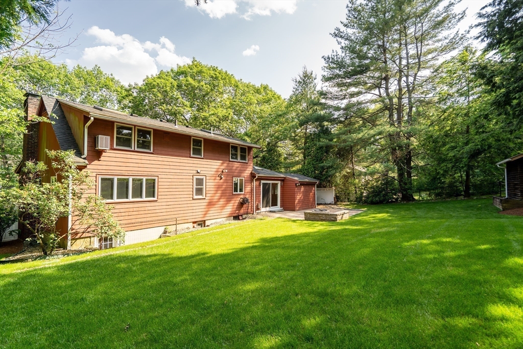 38 Maple Street Lexington, MA 02420 - Photo 36 of 40 a front view of house with yard and green space