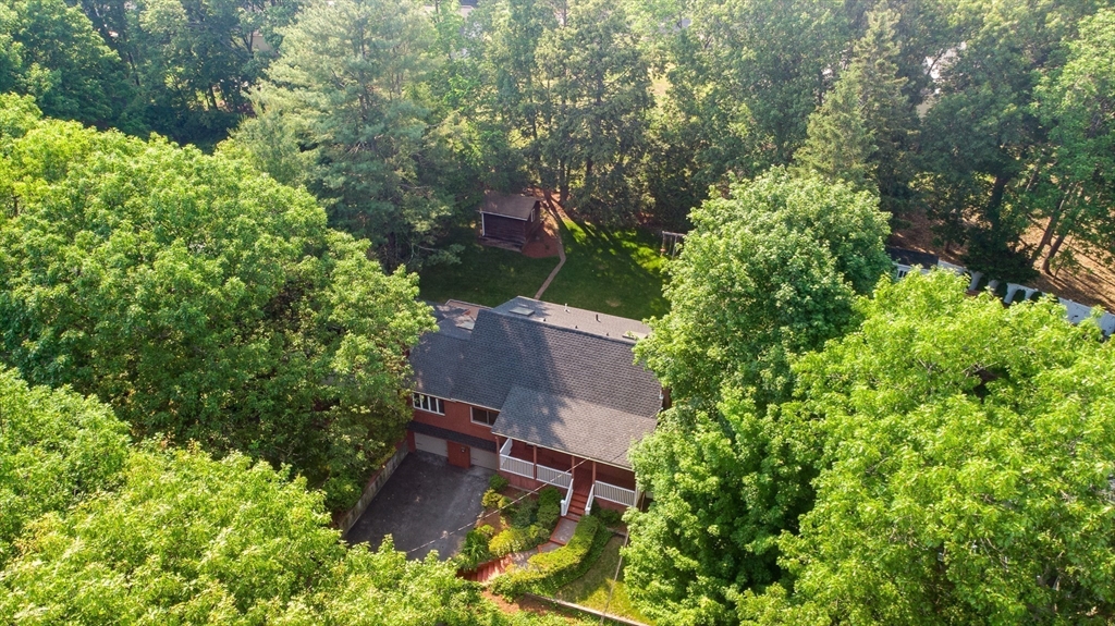 38 Maple Street Lexington, MA 02420 - Photo 38 of 40 an aerial view of a house with a yard