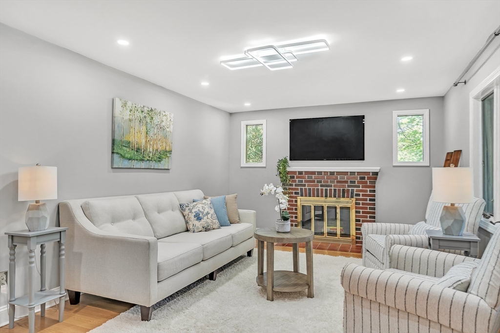 38 Maple Street Lexington, MA 02420 - Photo 4 of 40 a living room with furniture and a flat screen tv