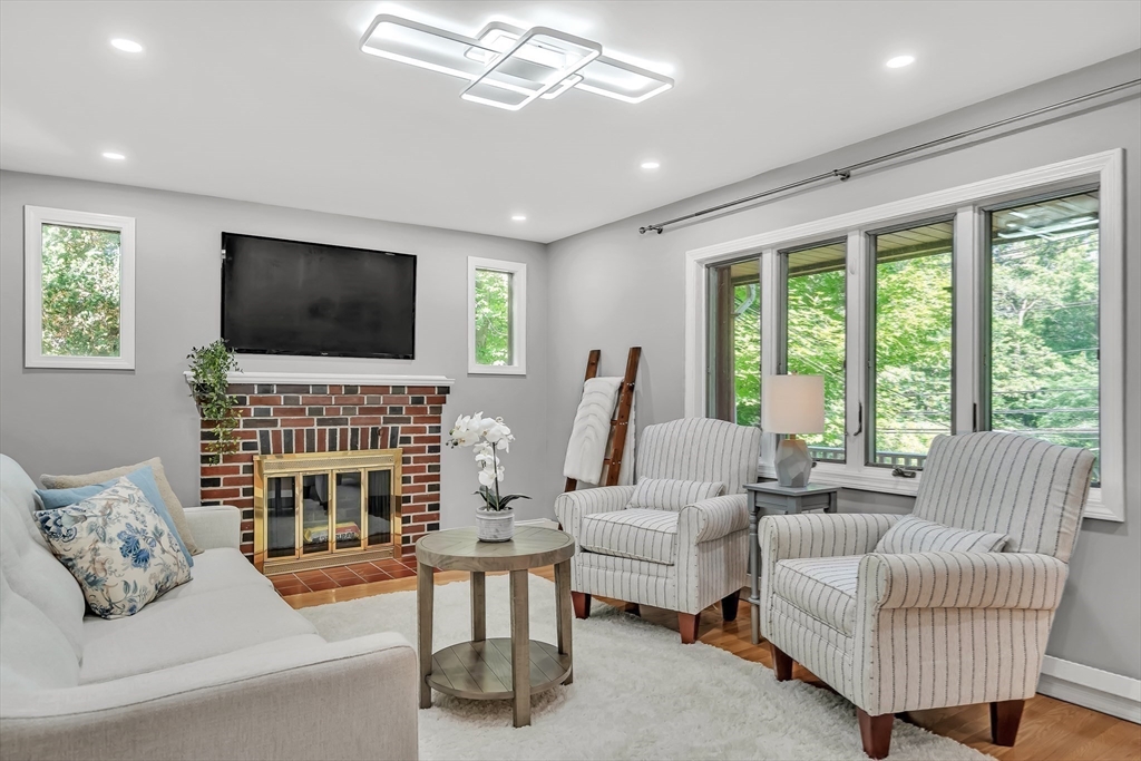 38 Maple Street Lexington, MA 02420 - Photo 6 of 40 a living room with furniture and a flat screen tv