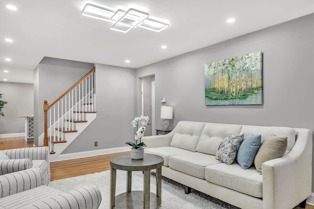 38 Maple Street Lexington, MA 02420 - Photo 8 of 40 a living room with furniture or couch and a dining table