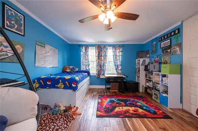 a living room with baby crib furniture and a baby crib