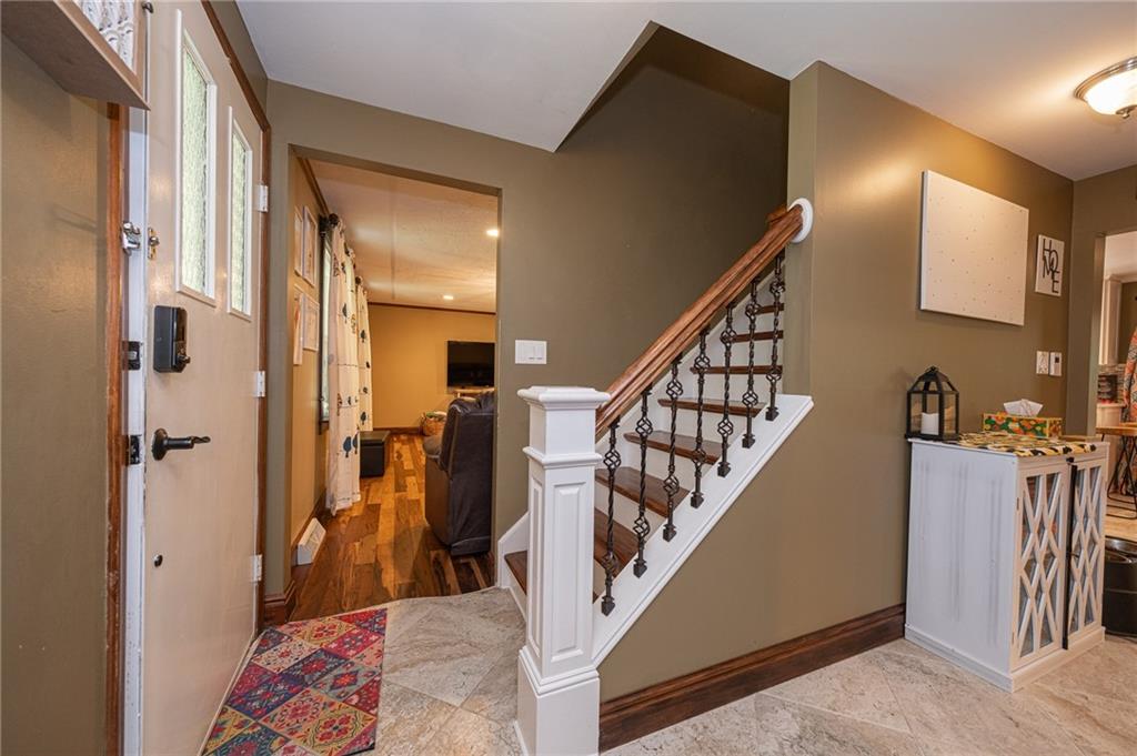 1072 Renton Road Pittsburgh, PA 15239 - Photo 2 of 42 a view of a hallway with wooden floor and stairs