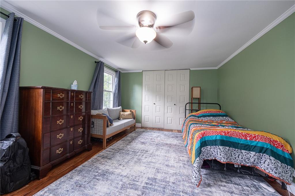 1072 Renton Road Pittsburgh, PA 15239 - Photo 21 of 42 a bedroom with a bed and a chandelier