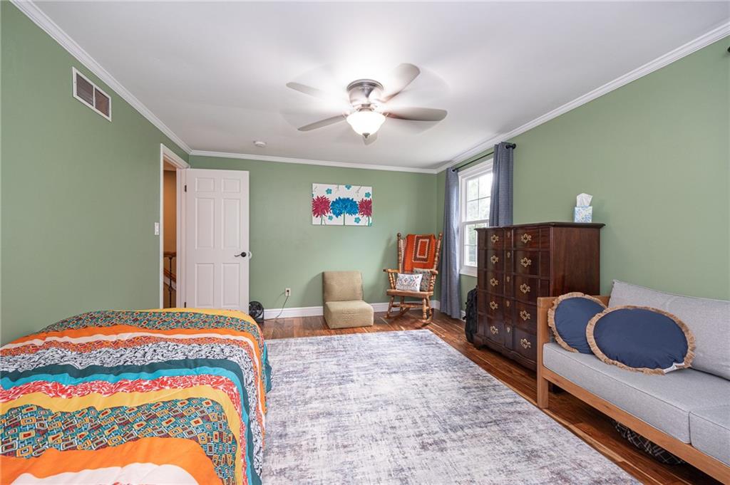 1072 Renton Road Pittsburgh, PA 15239 - Photo 22 of 42 a bedroom with a bed and a dresser with the outer view