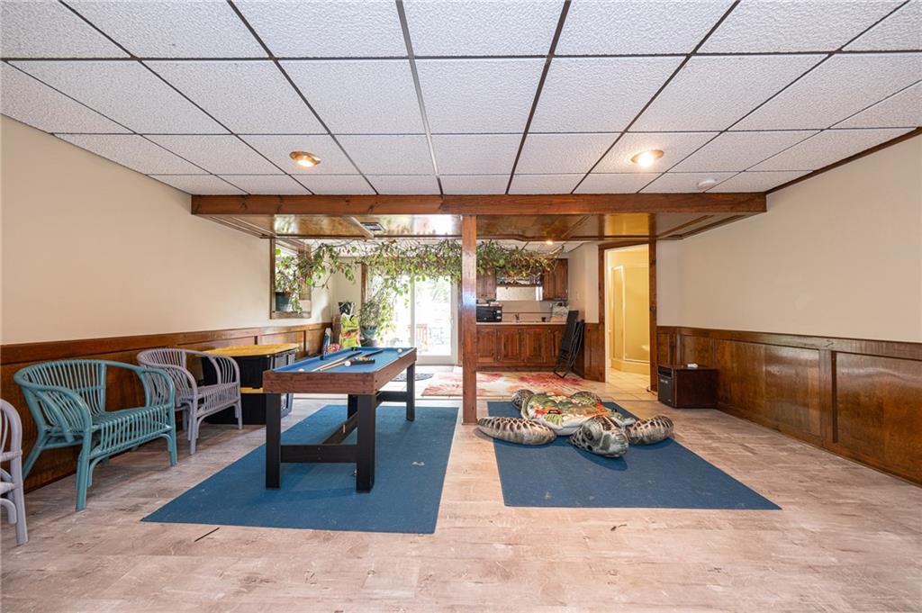 1072 Renton Road Pittsburgh, PA 15239 - Photo 26 of 42 a living room with furniture a rug and a table