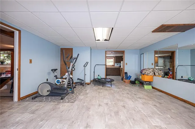 a kitchen with a sink cabinets appliances and a window