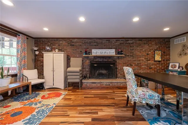 a lobby with furniture and a fireplace