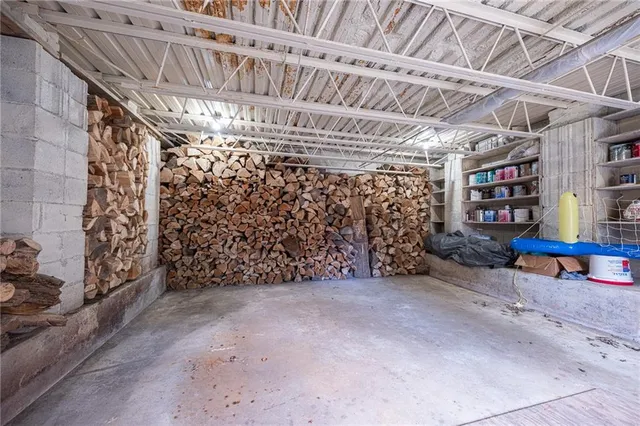 a view of a house with pool and chairs