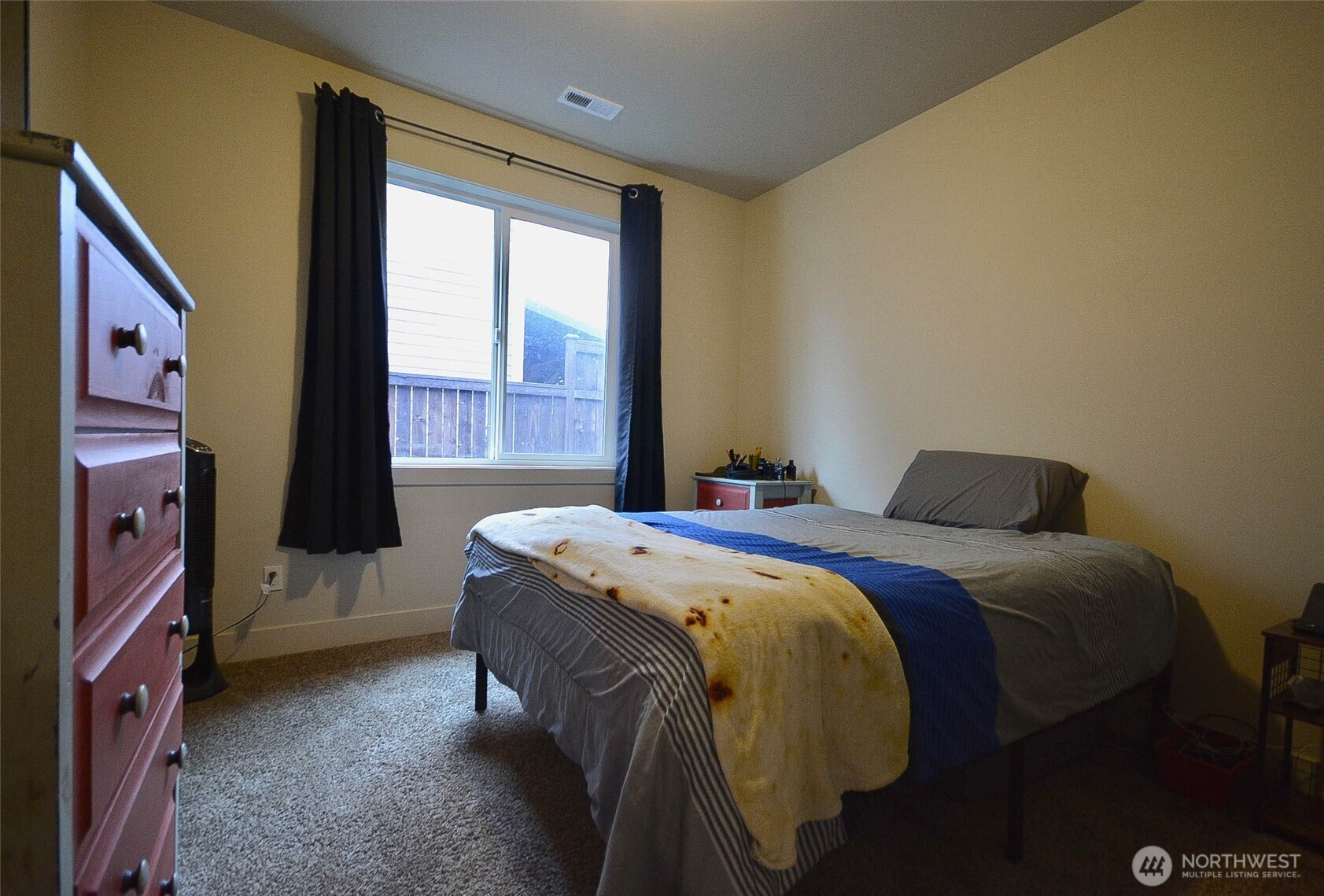 259 Parkside Loop Chehalis, WA 98532 - Photo 22 of 39 a bed sitting in a room next to a window