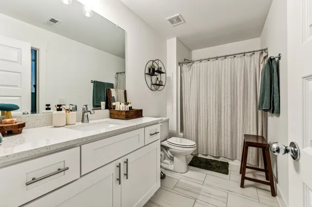 a bedroom with furniture and a window