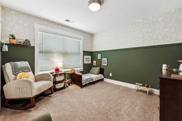 a view of house with a chairs in a balcony