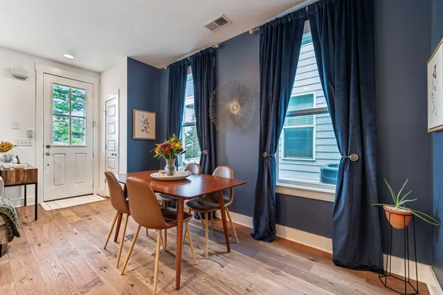 a view of a dining room with furniture and window