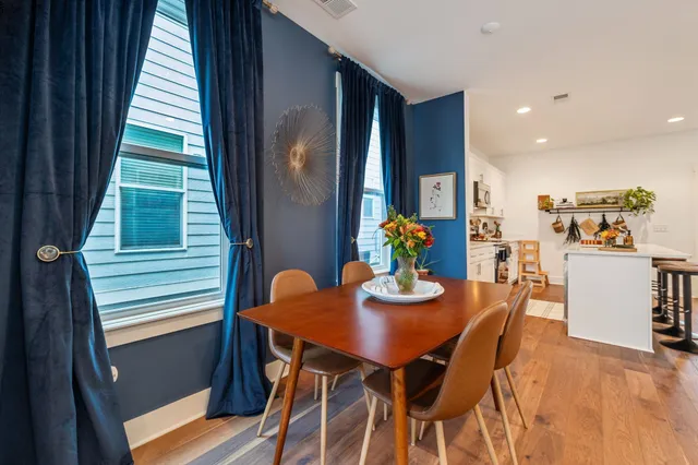 a view of a dining room with furniture and window