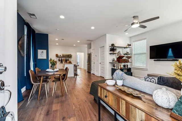 a view of a dining room with furniture and wooden floor