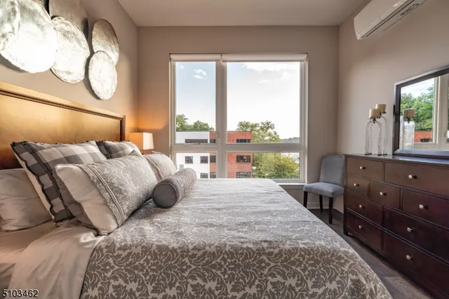 a bedroom with a large bed and a window