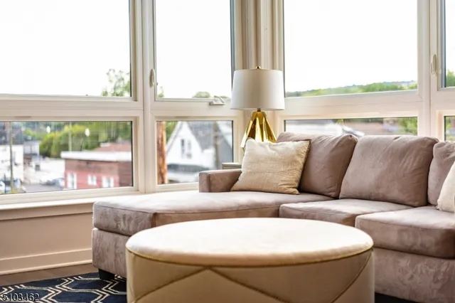 a living room with a couch and a large window