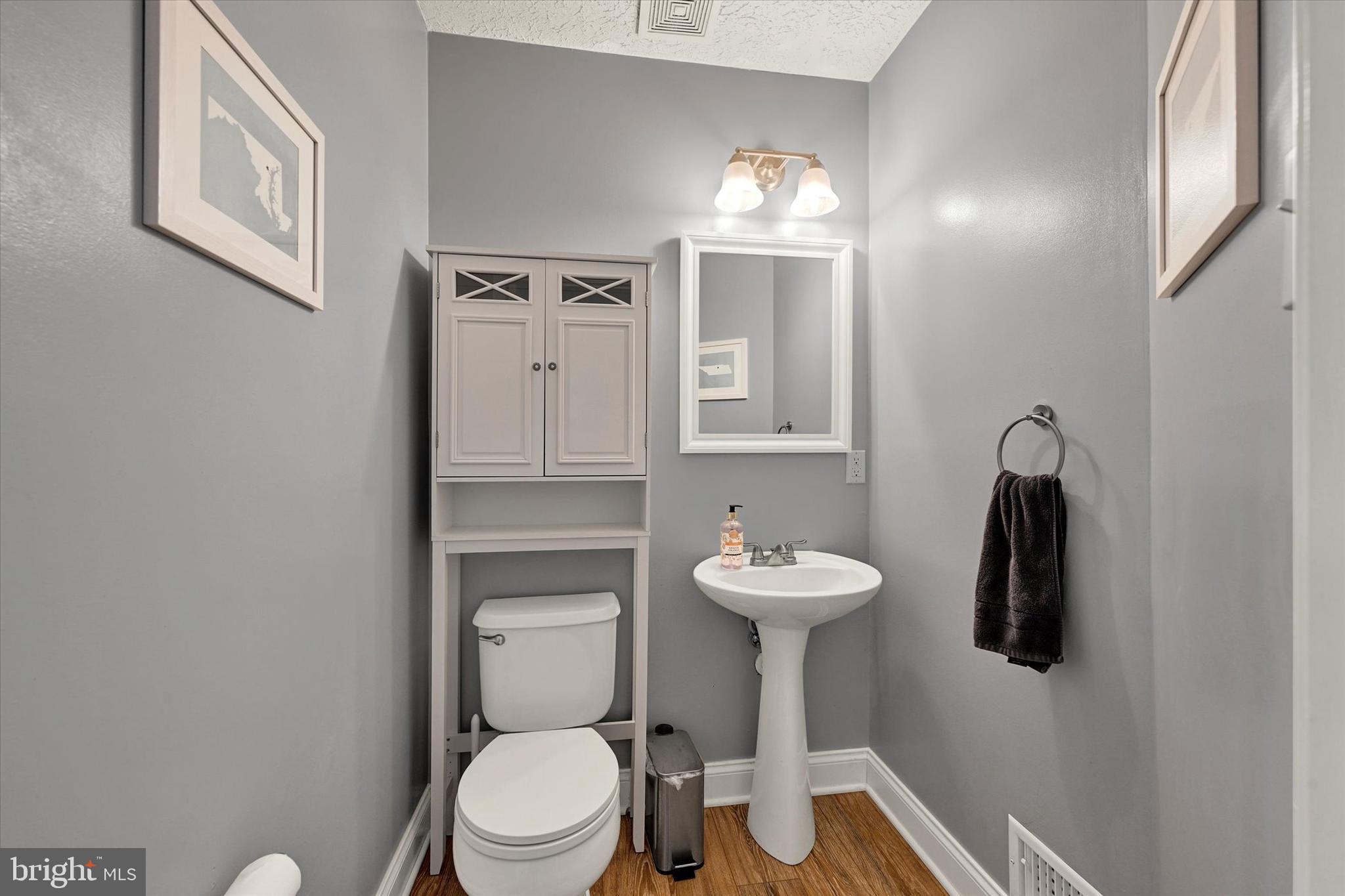 402 MacIntosh Circle Joppa, MD 21085 - Photo 16 of 29 a bathroom with a toilet sink and mirror