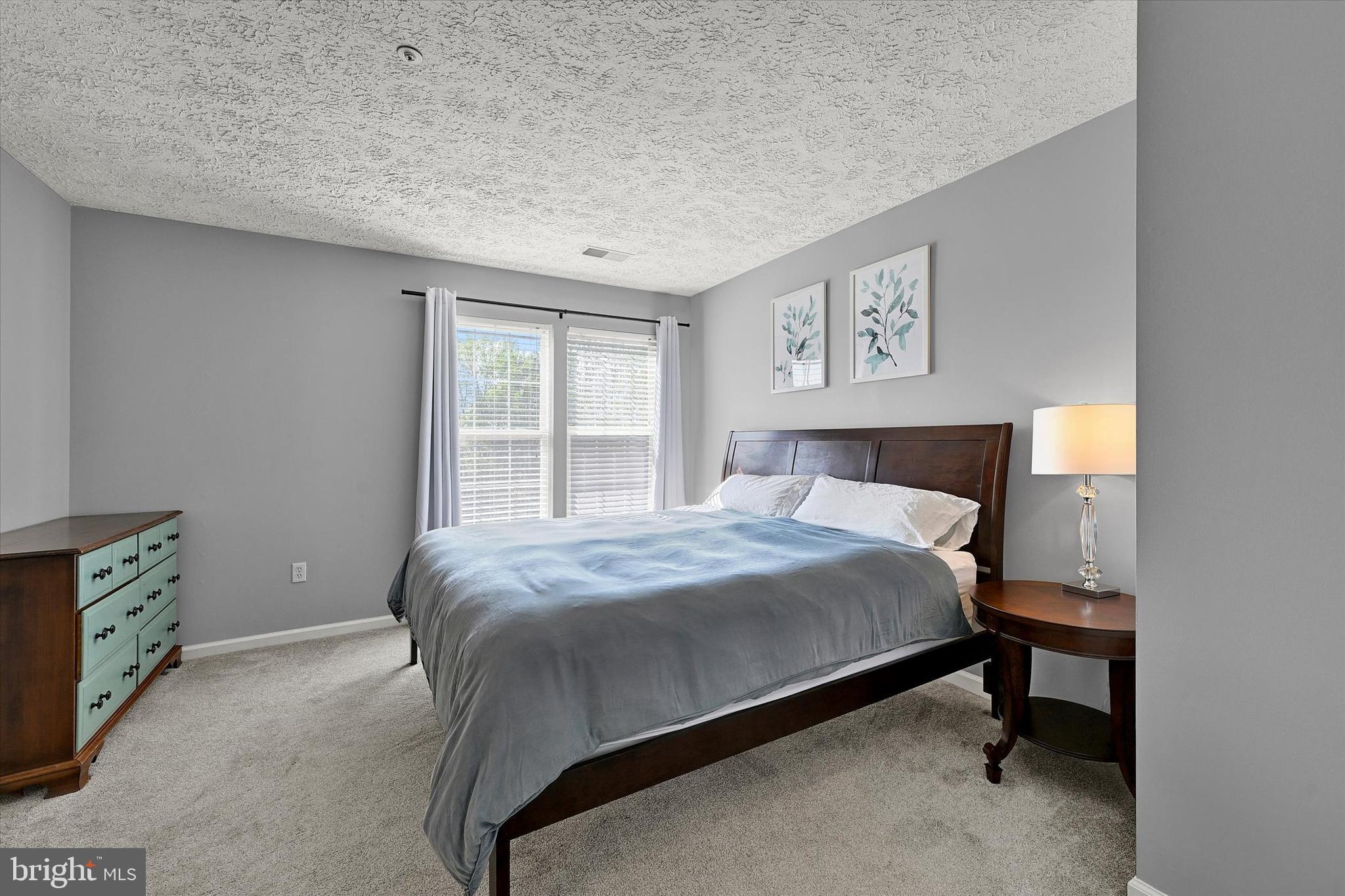 402 MacIntosh Circle Joppa, MD 21085 - Photo 19 of 29 a bedroom with a bed and a window