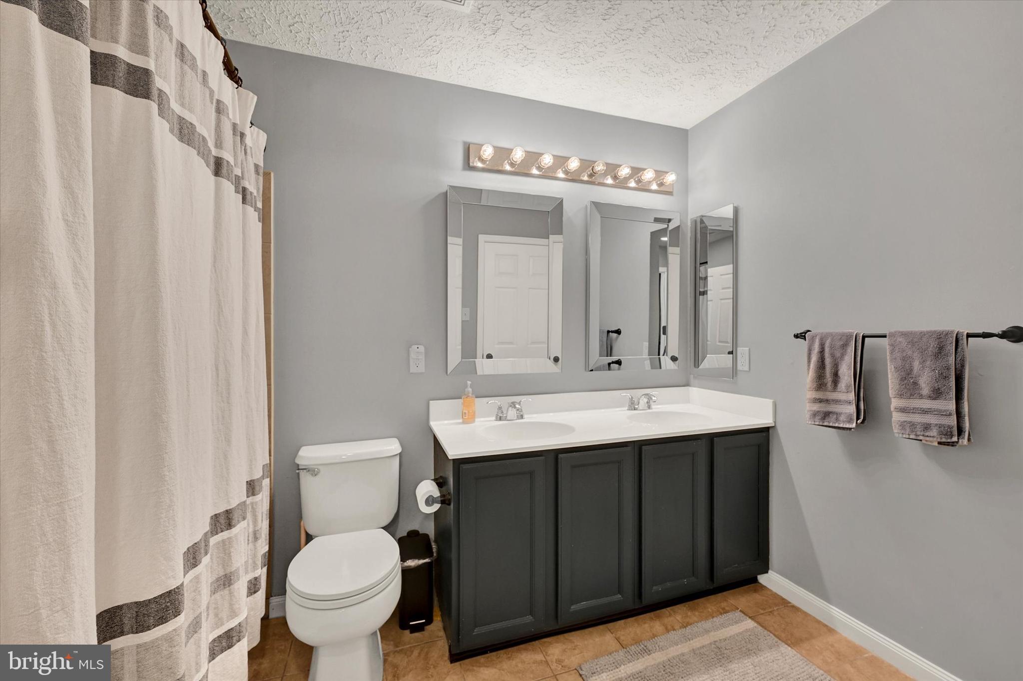 402 MacIntosh Circle Joppa, MD 21085 - Photo 21 of 29 a bathroom with a sink and a mirror