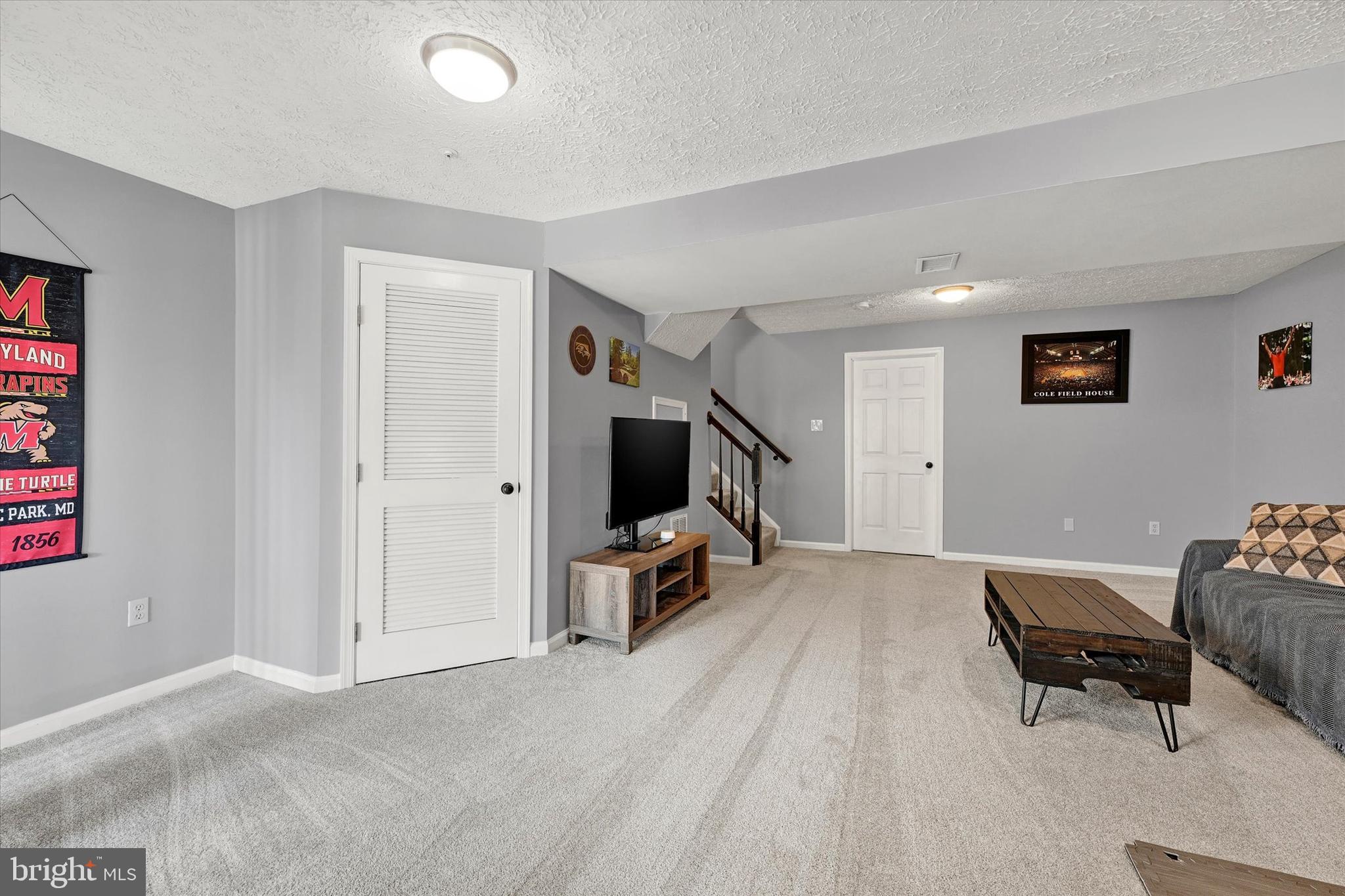 402 MacIntosh Circle Joppa, MD 21085 - Photo 23 of 29 a view of a livingroom with furniture and a flat screen tv