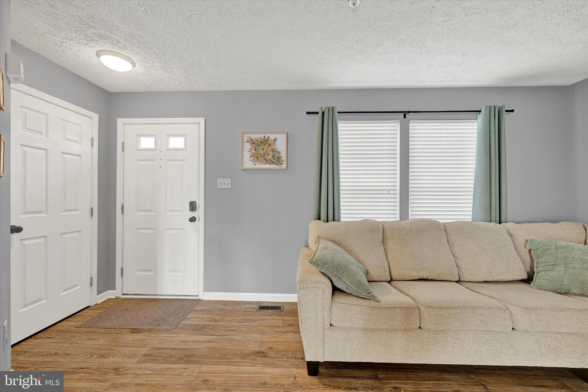 402 MacIntosh Circle Joppa, MD 21085 - Photo 5 of 29 a living room with furniture and a window