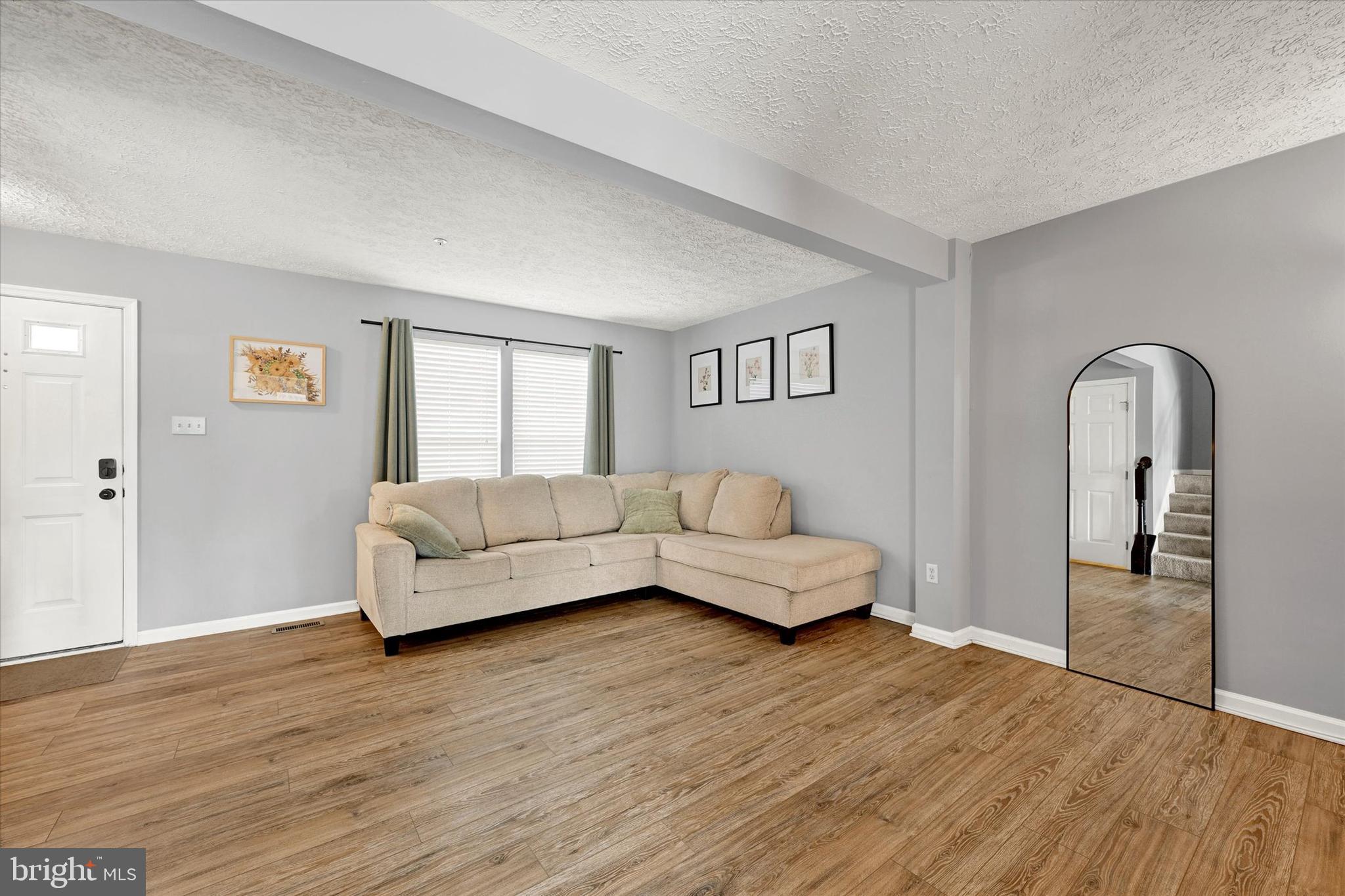 402 MacIntosh Circle Joppa, MD 21085 - Photo 6 of 29 a living room with furniture and a wooden floor