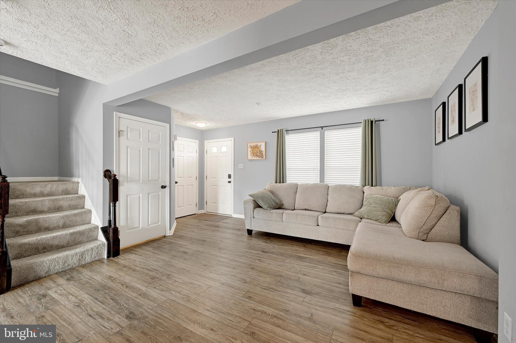 402 MacIntosh Circle Joppa, MD 21085 - Photo 7 of 29 a living room with furniture and a couch
