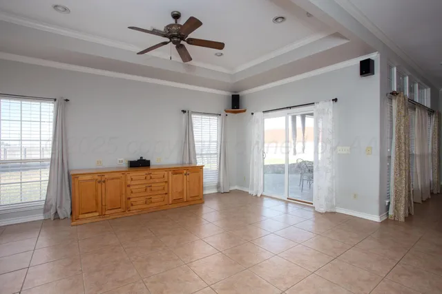 a view of livingroom with hardwood floor and a ceiling fan
