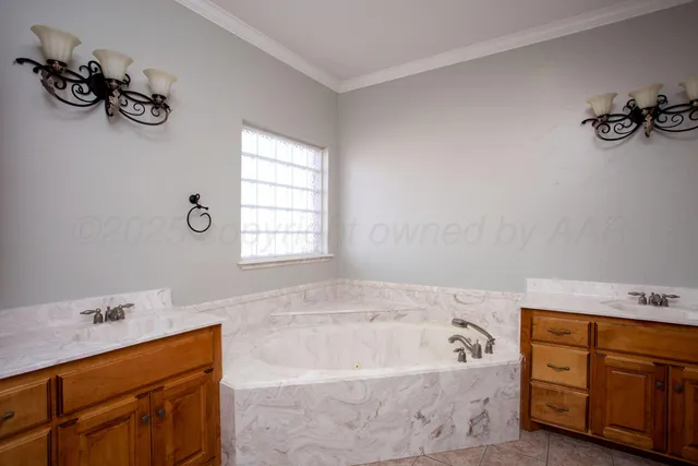 a bathroom with a tub sink and mirror