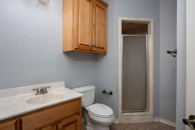 a view of a room with a ceiling fan